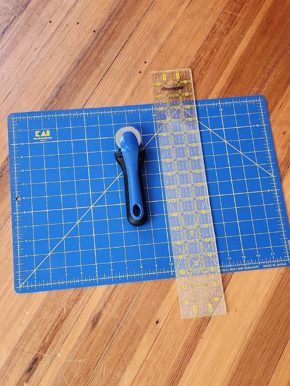 Kai Blue Self-Healing Cutting Mat with Blue Rotary Cutter And Omnigrid Ruler